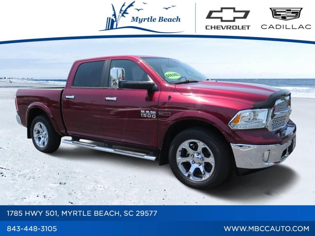 2017 RAM 1500 Laramie in Delmonico Red Pearlcoat — front three-quarter view
