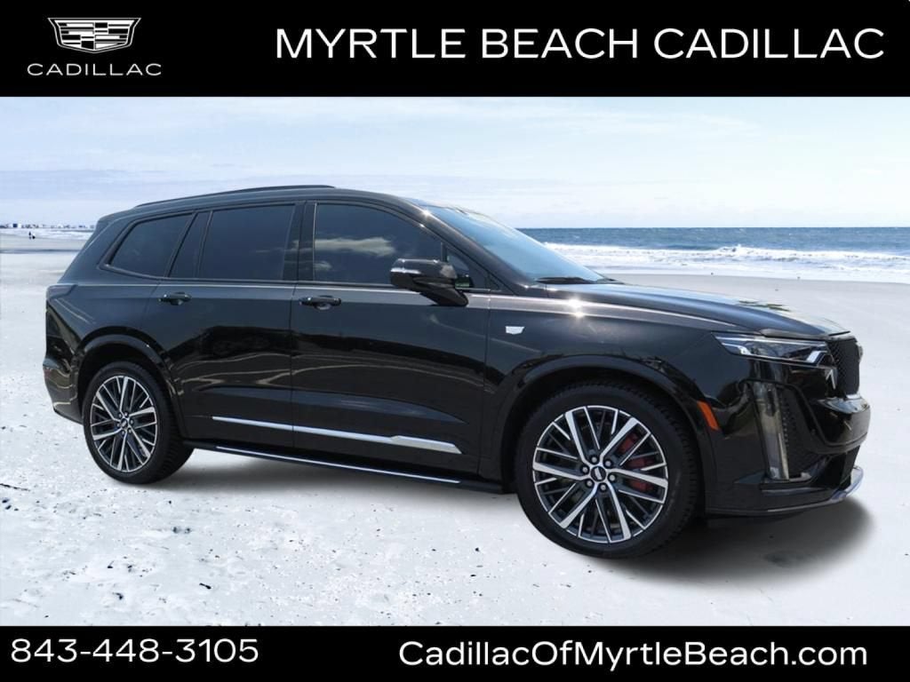 2025 Cadillac XT6 Sport in Stellar Black Metallic — front three-quarter view